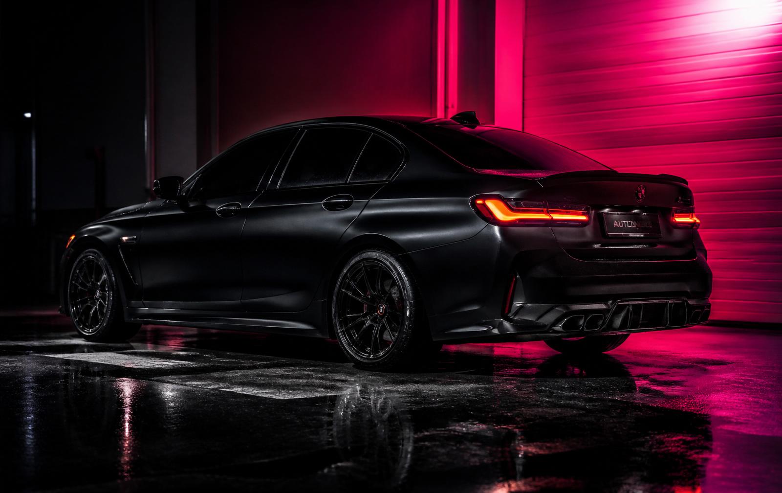 Matte black sedan with freshly installed ceramic window tint
